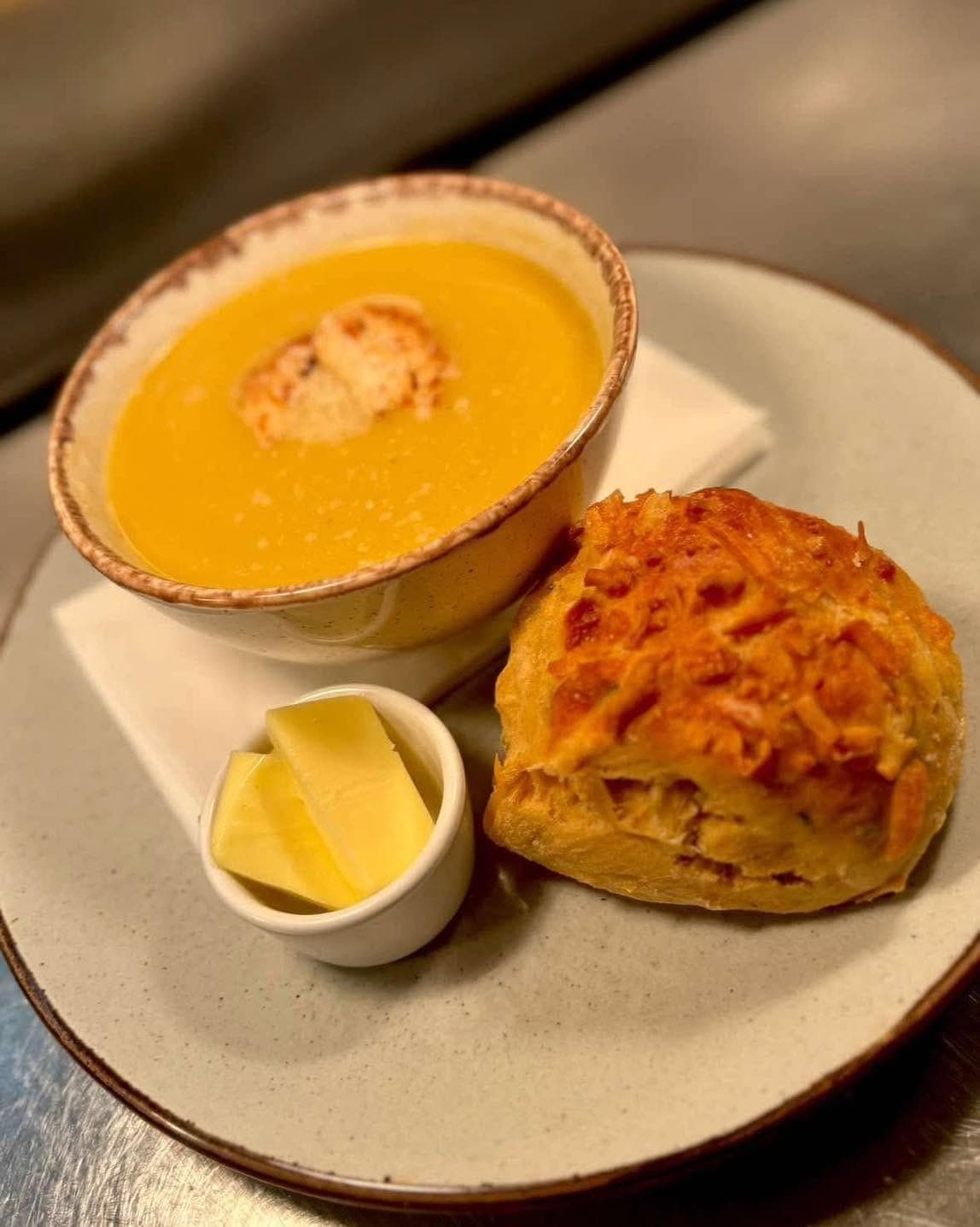 Homemade soup with a cheese scone